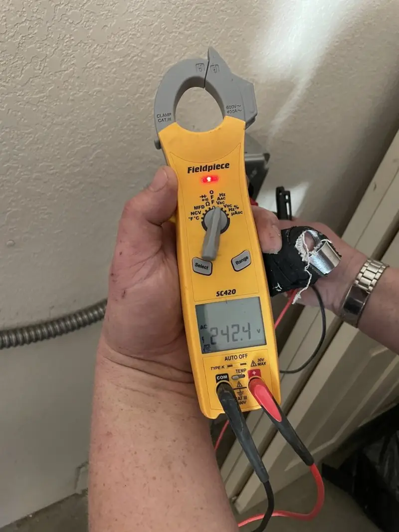 Voltage testing with clamp meter during Recessed Lighting Installation in Baden